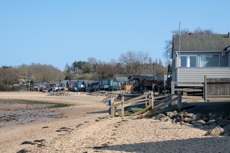 Row  wooden beachside homes on beach