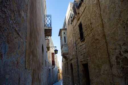 Back street in Mdina Malta with traditional stone housesの写真素材