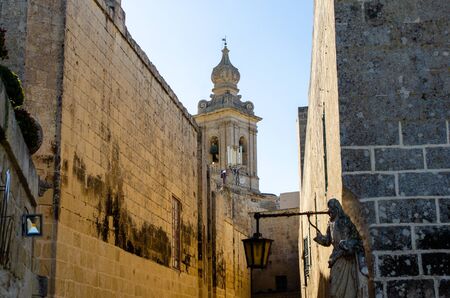 View of Mdina cathedral through streetの写真素材