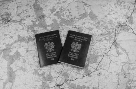 Map and two passports ready to be used. Black and white photo.
