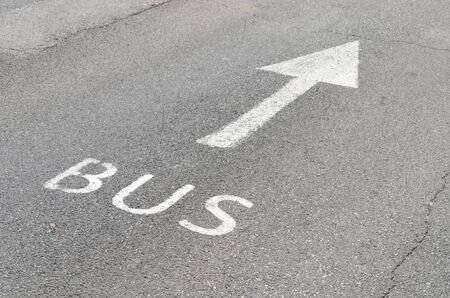 Bus lane sign on the asphalt roadの写真素材