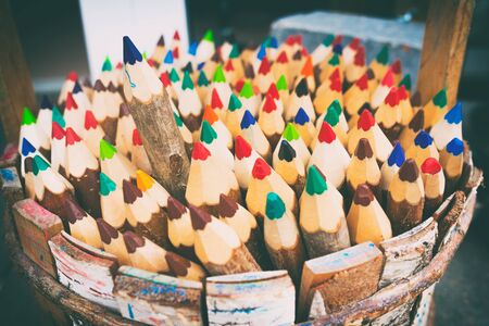 One of the pencils selected among the heap of others. Business concept in choosing ideal person from many candidates. Selective focus. Vintage styleの写真素材