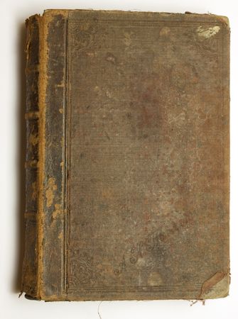 Very old brown book over white backgroundの写真素材
