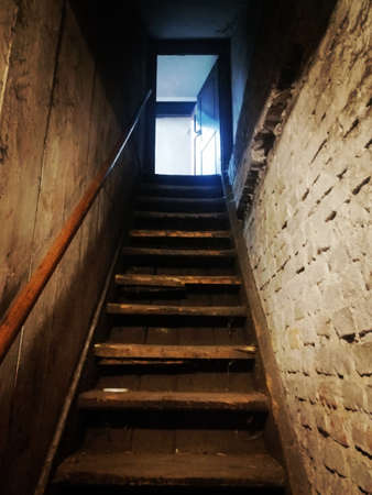 Stairs to the basement of an old abandoned house. High quality photo