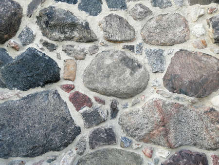 Background of stone wall texture. Close up of stone wall texture.の写真素材
