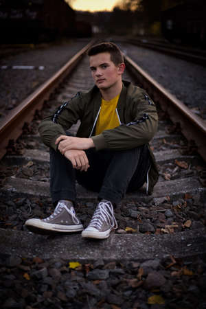 Posing on the railways, at the sunset.の写真素材