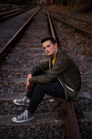 Posing on the railways, at the sunset.の写真素材