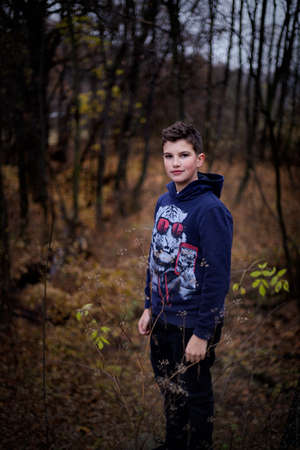 A nice boy posing in wild natureの写真素材