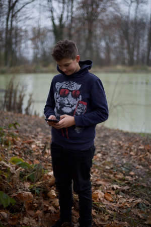 A nice boy posing in wild nature