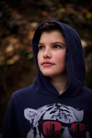 A nice boy posing in wild natureの写真素材