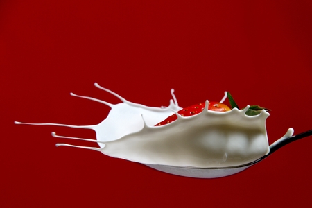 Strawberry in milk splashの写真素材