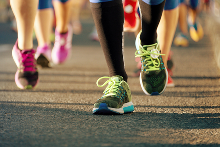 Marathon running in the light of eveningの写真素材