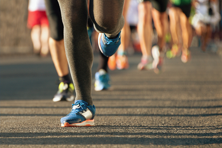 Marathon running in the light of eveningの写真素材