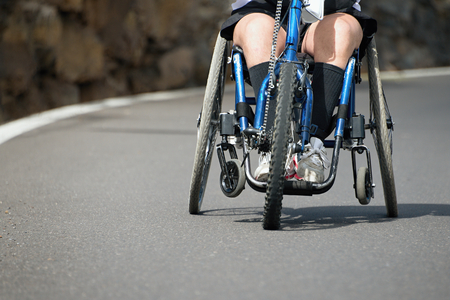 Single wheelchair athlete in action during a marathonの写真素材