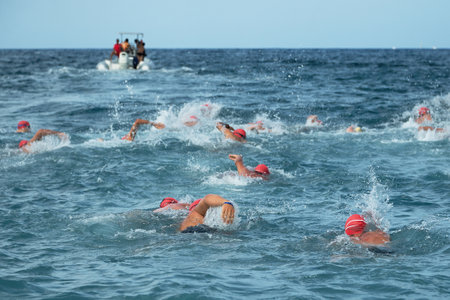 Group people in wetsuit swimming at seaのeditorial素材