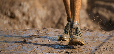 Mud race runners,detail of the legs
