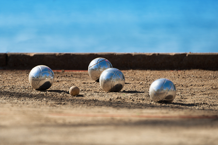 Metallic petanque four balls and a small wood jackの写真素材