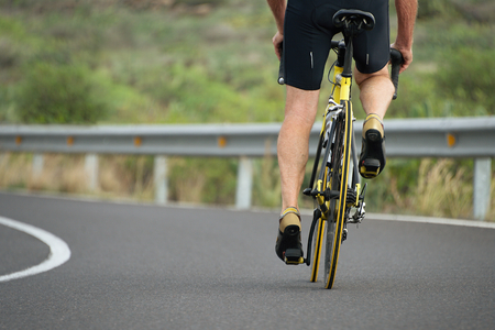 Active senior with bicycle,cyclist on road bikeの写真素材