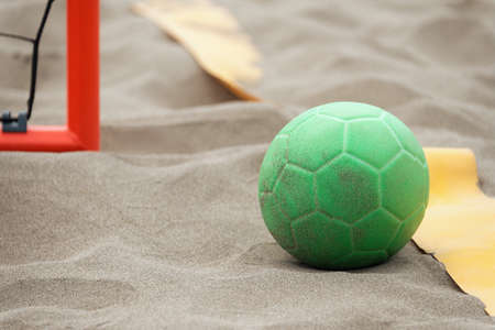 Handball ball on the beach in the sand