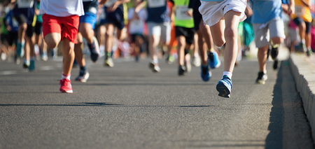 Running children, young athletes run in a kids run raceの写真素材