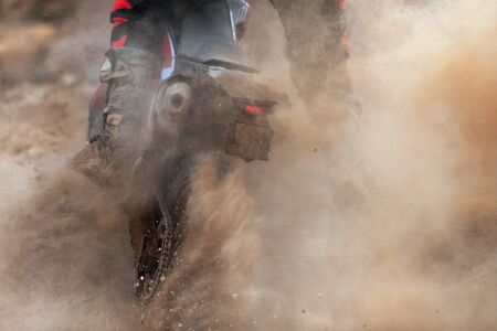 Motocross racer accelerating speed in track,driving in the motocross raceの写真素材