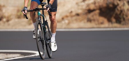 Road bike cyclist man cycling,athlete on a race cycleの写真素材