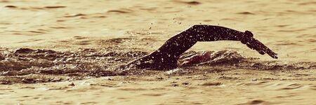 Silhouette man triathlon man athlete swimmers swimmingの写真素材