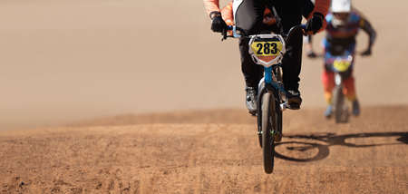 BMX riders competing in the child class on the off-road circuit