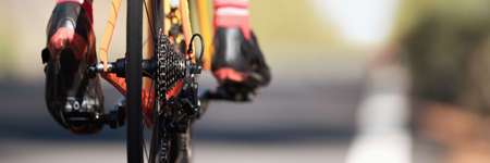 Racing - bike detail on gear wheels and feet