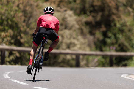 Road bike cyclist man cycling, athlete on a race cycleの写真素材