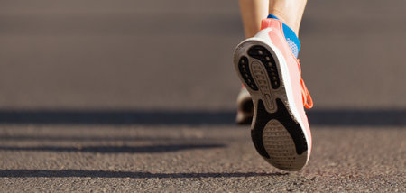 Athlete runner feet running on road close up on shoe, marathon running raceの写真素材