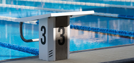 Starting platforms with number 3 for swimming races and competitions. Swimming pool starting block No.3. Sport and swimming conceptの写真素材