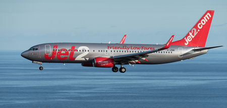 Tenerife, Spain June 4th, 2023. Boeing 737 of Jet2 Airlines flies in the blue sky over the oceanのeditorial素材