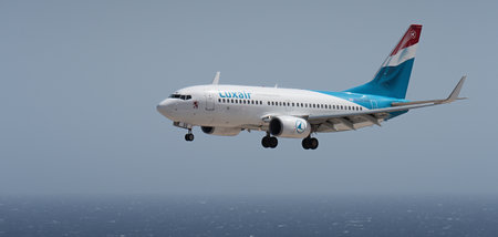 Tenerife, Spain august 2st, 2023. Boeing 737-700 of Luxair Airlines flies in the blue sky over the oceanのeditorial素材