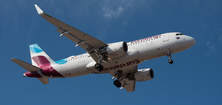 Tenerife, Spain January 3rd, 2024. Airbus A320-214 Eurowings Airlines flies in the blue sky. Landing at Tenerife Airportのeditorial素材