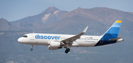 Tenerife, Spain January 13th, 2024. Airbus A320-214 Discover Airlines flies in the blue sky. Landing at Tenerife Airport. El Teide volcano in the backgroundのeditorial素材