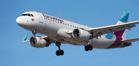 Tenerife, Spain January 17th, 2024. Airbus A320-214 Eurowings Airlines flies in the blue sky. Landing at Tenerife Airportのeditorial素材