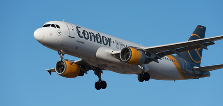 Tenerife, Spain January 17th, 2024. Airbus A320-212 Condor Airlines flies in the blue sky. Landing at Tenerife Airportのeditorial素材