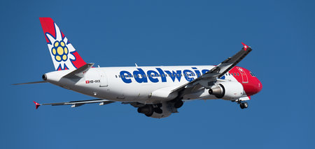 Tenerife, Spain January 21st, 2024. Edelweiss Air Airlines, Airbus A320-214. Edelweiss Air flies in the blue skyのeditorial素材