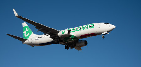 Tenerife, Spain February 18th, 2024. Boeing 737-8HX Transavia Airlines flies in the blue sky. Landing at Tenerife Airportのeditorial素材