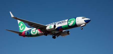 Tenerife, Spain February 18, 2024. Boeing 737-8K2 Transavia Airlines flies in the blue sky. Landing at Tenerife Airportのeditorial素材