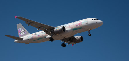 Tenerife, Spain February 21st, 2024. Airbus A320-214 Sundair Airlines flies in the blue sky. Landing at Tenerife Airportのeditorial素材