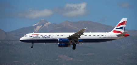 Tenerife, Spain March 30th, 2024. Airbus A321-231 British Airways Airlines flies in the blue sky. Landing at Tenerife Airport. El Teide volcano in the backgroundのeditorial素材