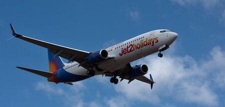 Tenerife, Spain March 31st, 2024. Boeing 737-8MG Jet2 Airlines flies in the blue sky. Landing at Tenerife Airportのeditorial素材
