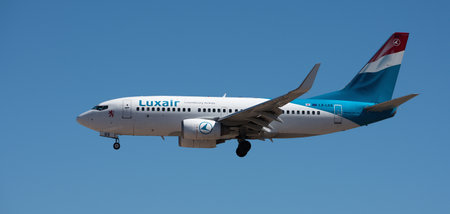 Tenerife, Spain May 4th, 2024. Boeing 737-7C9 Luxair Airlines flies in the blue sky. Landing at Tenerife Airportのeditorial素材