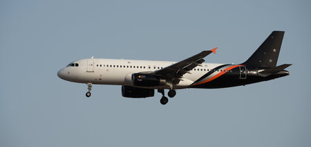 Tenerife, Spain July 18th, 2024. Airbus A320-233 Titan Airways Airlines flies in the blue sky. Landing at Tenerife Airportのeditorial素材