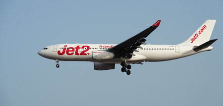 Tenerife, Spain July 18th, 2024. Airbus A330-243 Jet2 Airlines flies in the blue sky. Landing at Tenerife Airportのeditorial素材