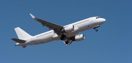 Airplane take off on the blue sky, Aircraft flying on sky background. White passenger jet plane in...