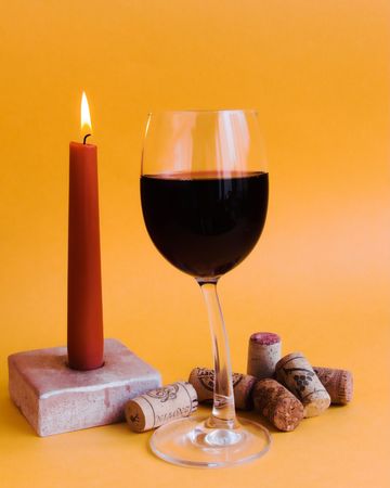 A candle and one wine glassの写真素材