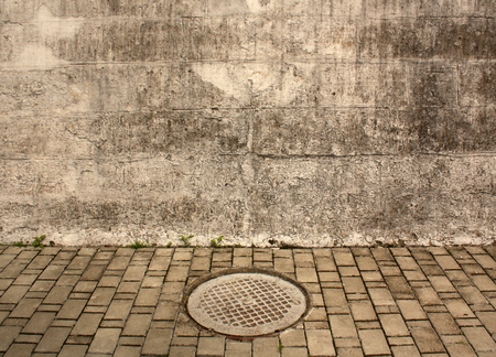 Manhole cover. Architectural backgroundの写真素材